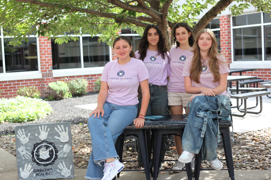 Students with a bench grown from mycelium-based material