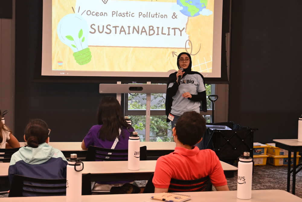 Student presenting on ocean plastic pollution and sustainability at AWS