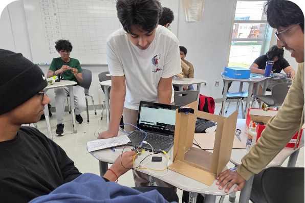 Students building and wiring a prototype during a school-day Orblynx session in a partner classroom